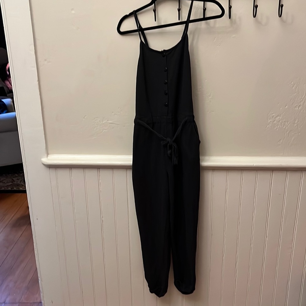 sleeveless, cross-back jumpsuit, straight cuffed leg, button up w/front tie